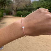 PULSERA CUARZO ROSA Y CORAZON DE PLATA MACRAME